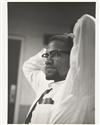 MALCOLM X. SCHATT, ROY. Group of five gelatin silver prints of Malcolm X, taken while on the ""Long John Nebel"" radio program.